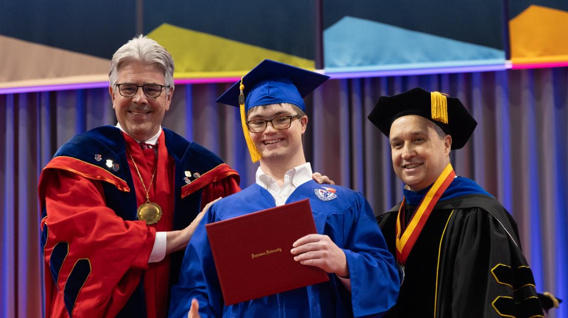 President Gormley, graduate and Dean Akinci