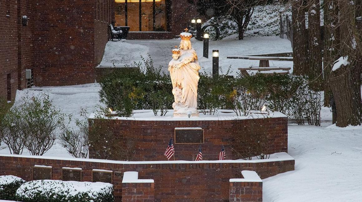 blessed mother statue in snow