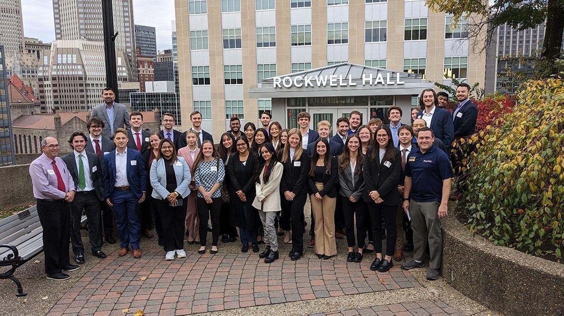Case competition participants outside Rockwell Hall