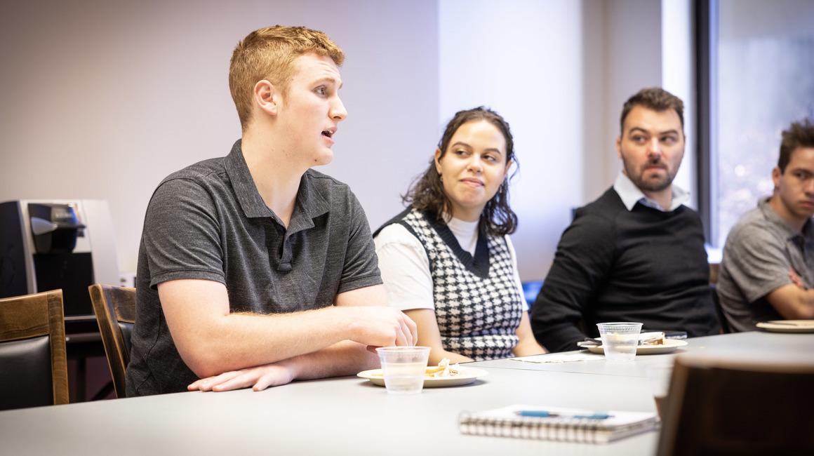 Students attend a discussion about journalism in the Berger Gallery