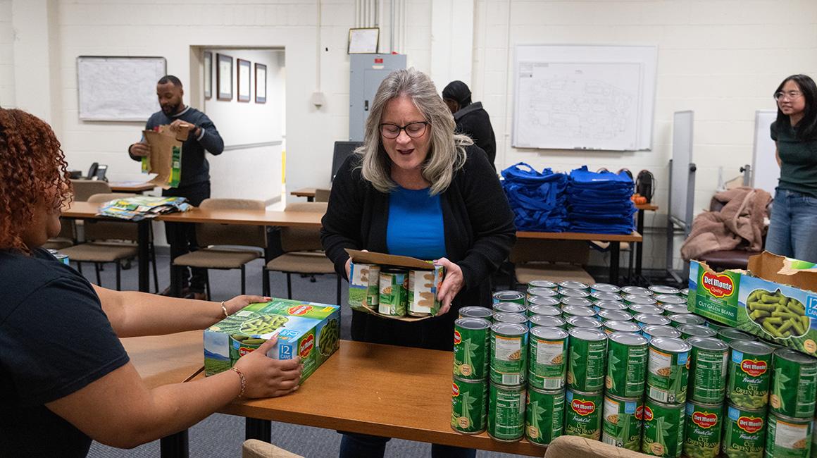 A Duquesne staff member assists with The Center's Turkey Drive