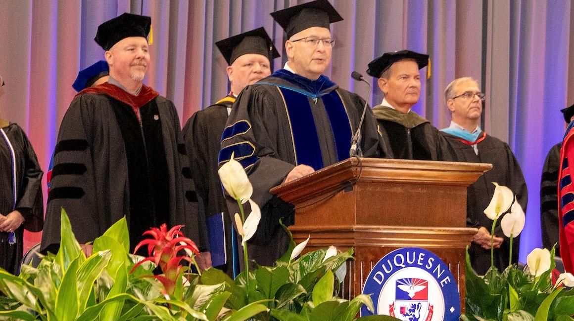 Pharmacy Dean Drennen at Commencement Podium