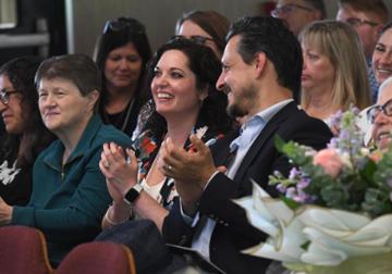 Staff members applaud during the Staff Appreciation celebration.