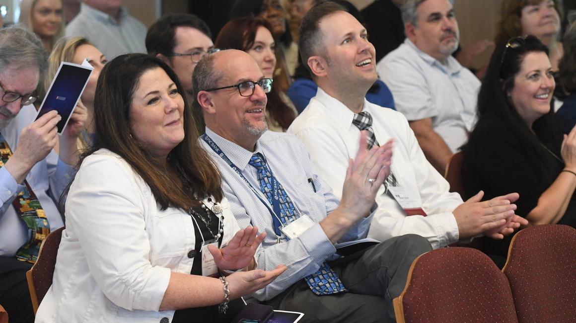 Staff and faculty applaud during the Staff and Faculty Appreciation celebration.