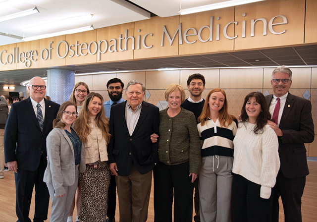 Dr. John Kaufmann, President Ken Gormley, the Nasuti's and group of medical students