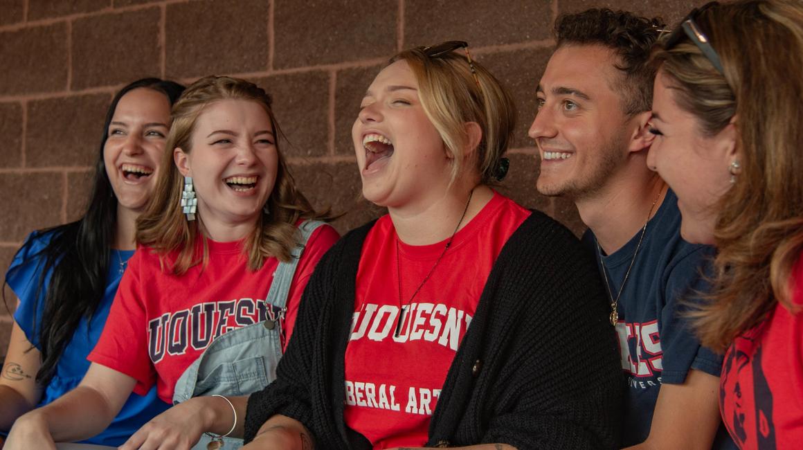 group of students laughing together
