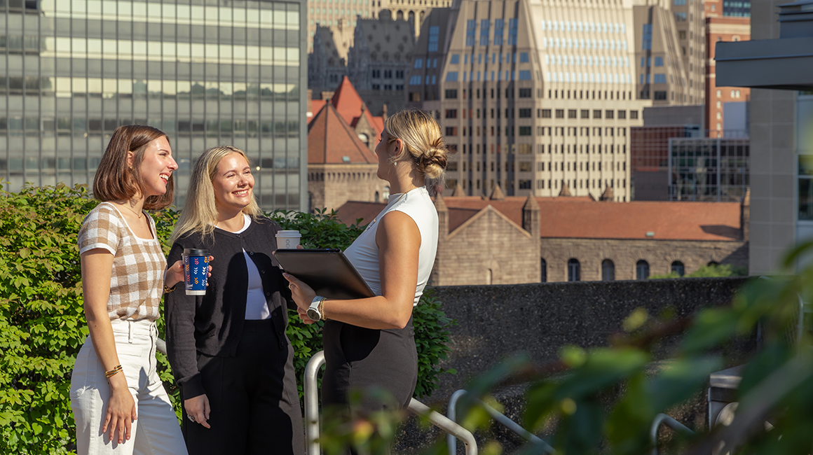 Students talk in a group outside of Rockwell Hall on Duquesne's campus