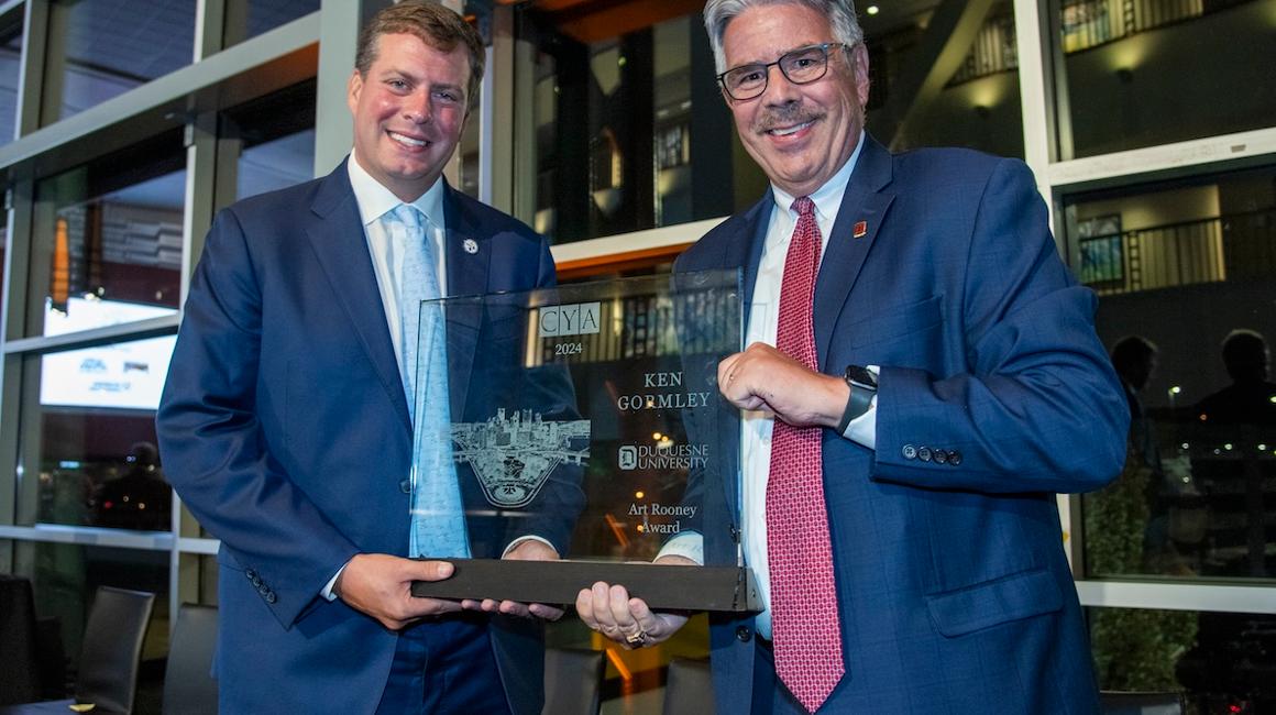 Dan Rooney and Ken Gormley hold award
