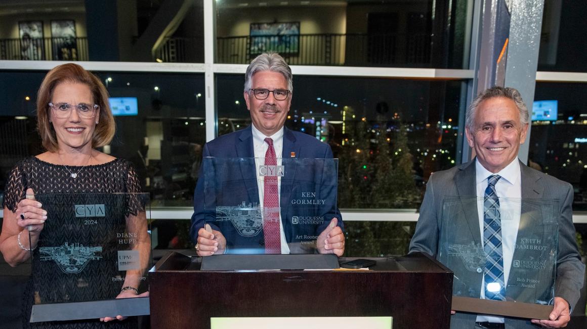 Diane Hupp, Ken Gormley and Keith Dambrot hold their award plaques