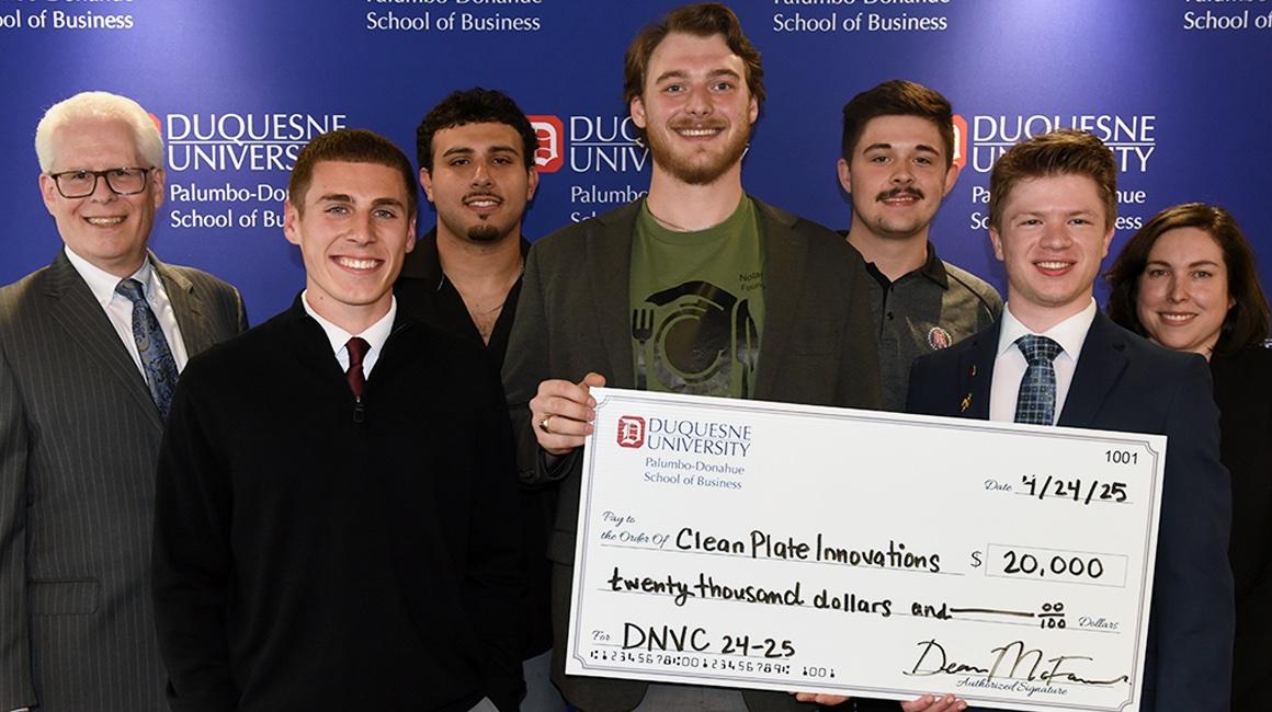 Winners of the 2024 - 2025 DNVC stand with their award check.