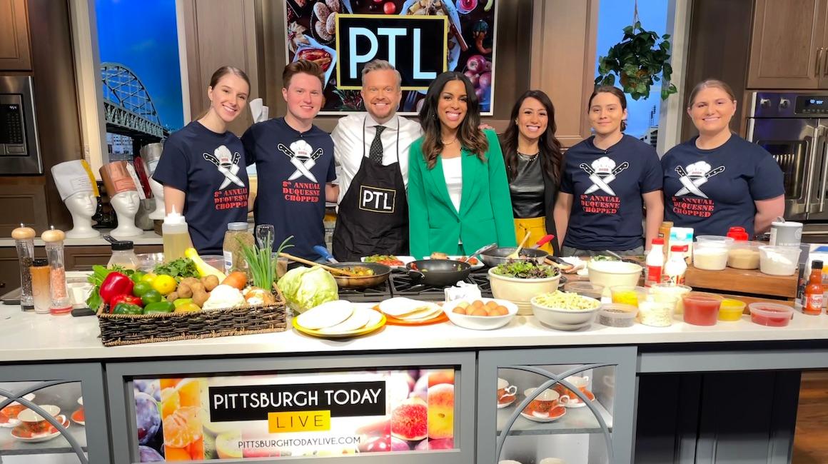 Duquesne students smiling with KDKA anchors on set of Pittsburgh Today Live