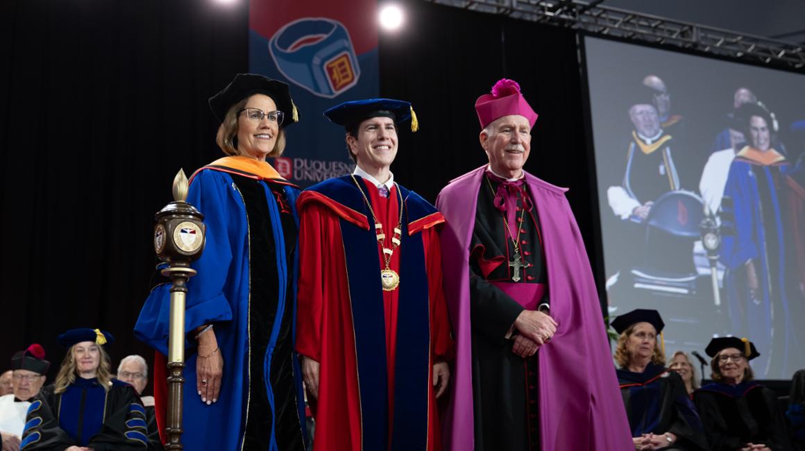 Diane Hupp, David Dausey, and Bishop Eckman