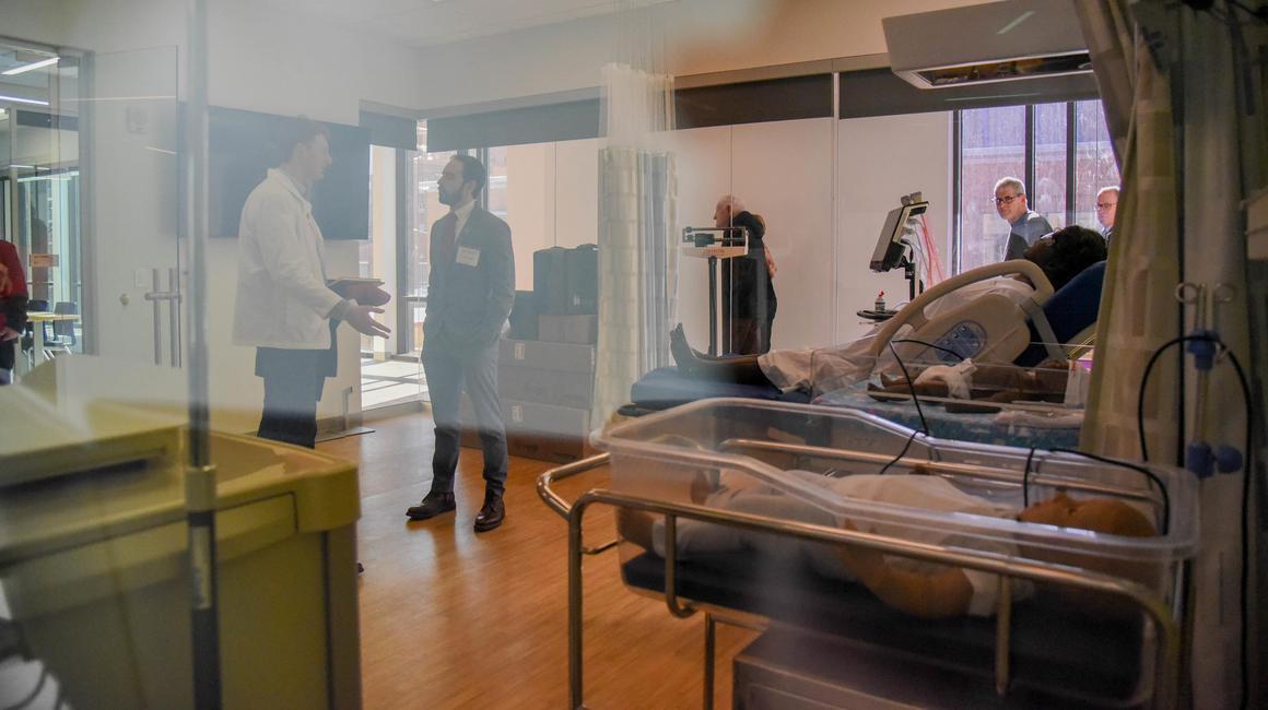 Individuals gather and talk in Duquesne's Nasuti College of Osteopathic Medicine