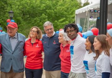President and Laura Gormley, center, with board members and students.