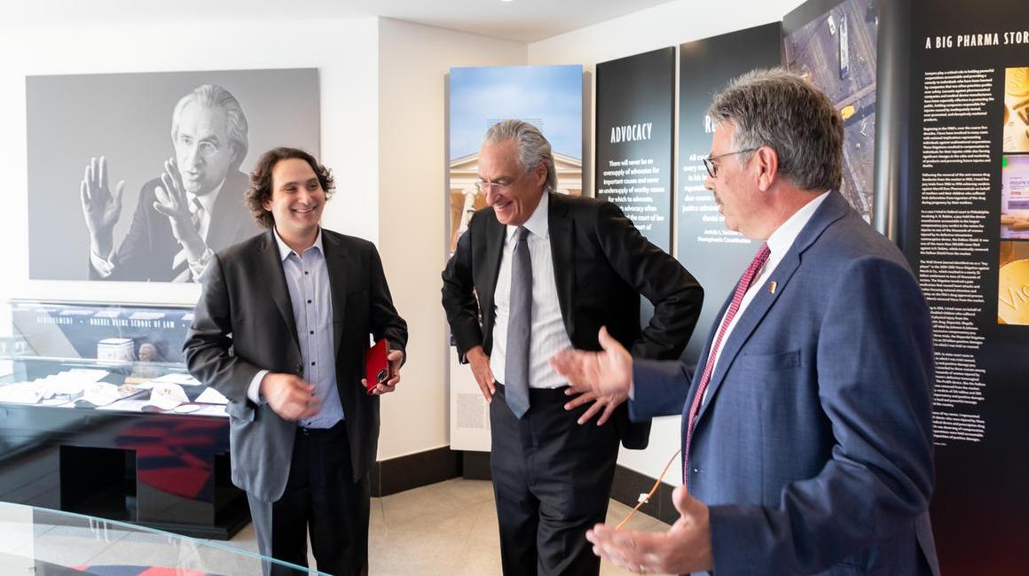 Zac Kline, Thomas R. Kline and President Ken Gormley talking in archival collection room at the Thomas R. Kline School of Law of Duquesne University.