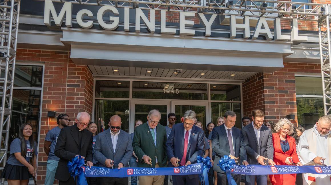 Ribbon cutting at McGinley Hall dedication