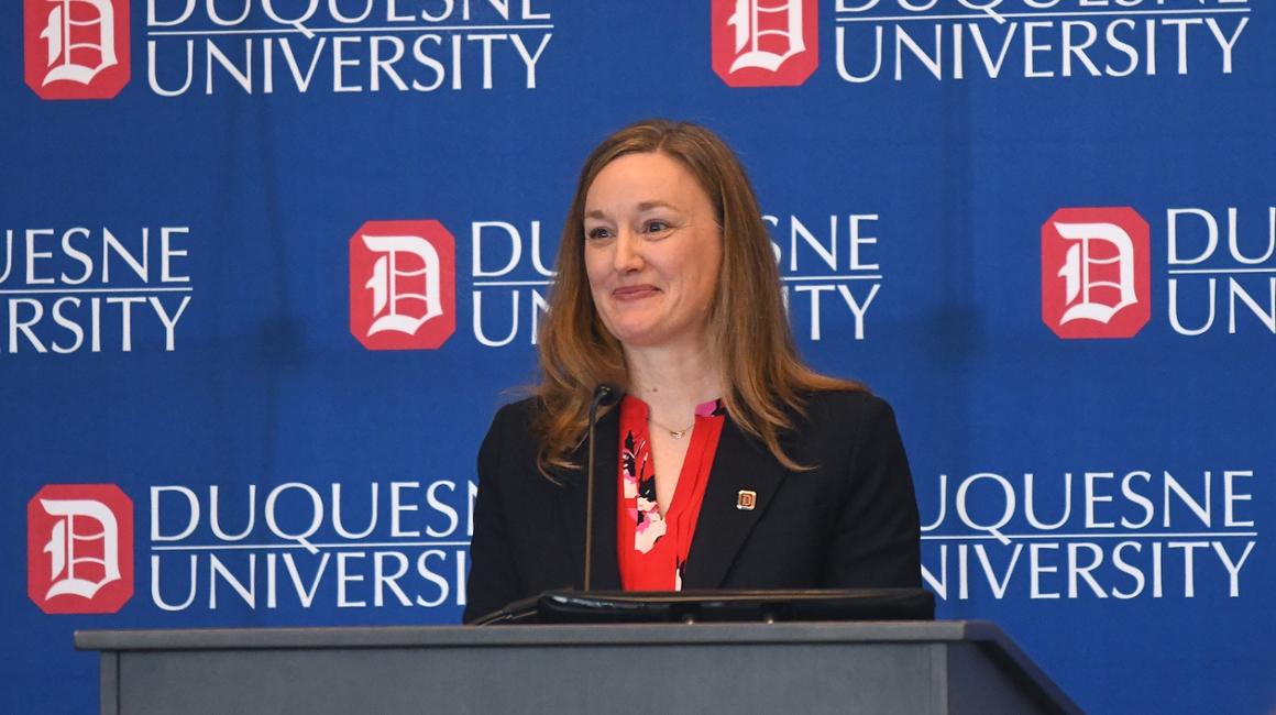 Dr. Sarah Ewing at Podium