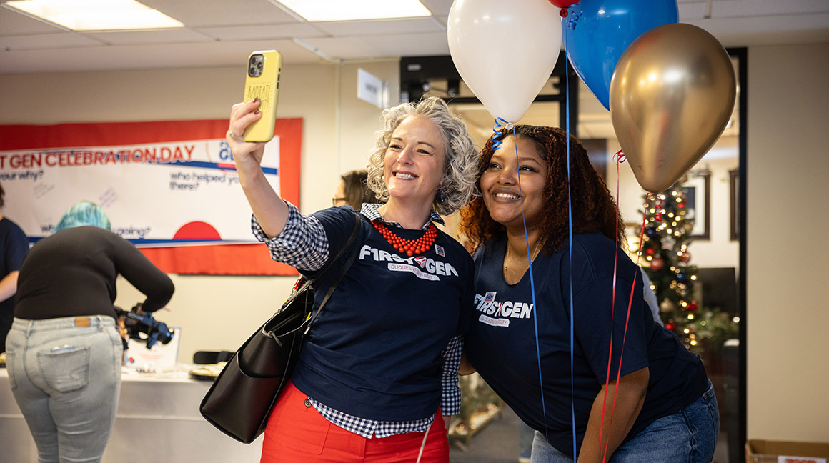 Dr. Leanna Fenneberg takes a selfie with a student on First Generation Celebration Day 2024.