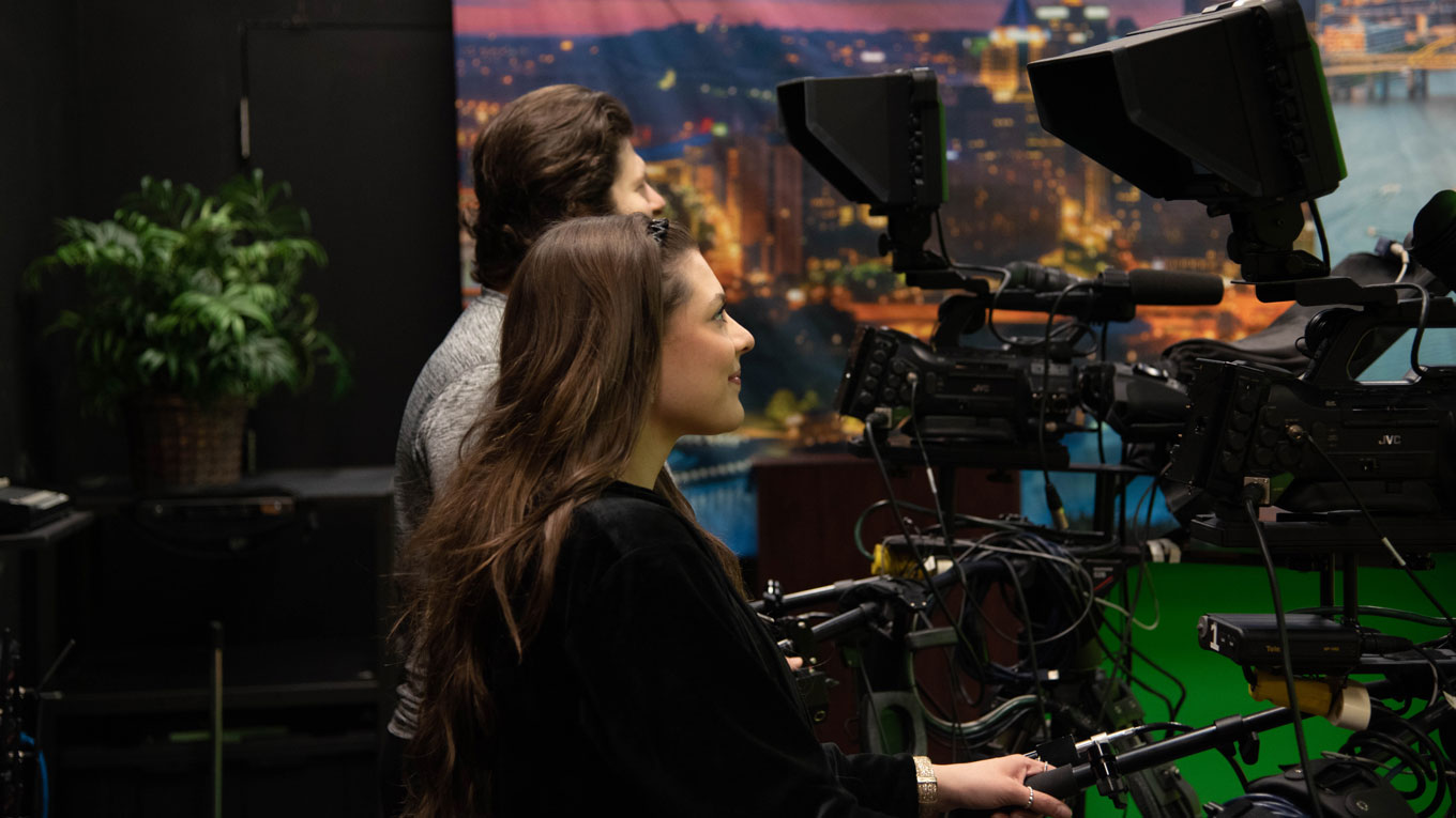 students using camera equipment