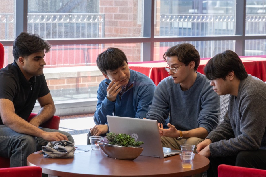 4 students prepare for their presentation at Hacking4Humanity 2026