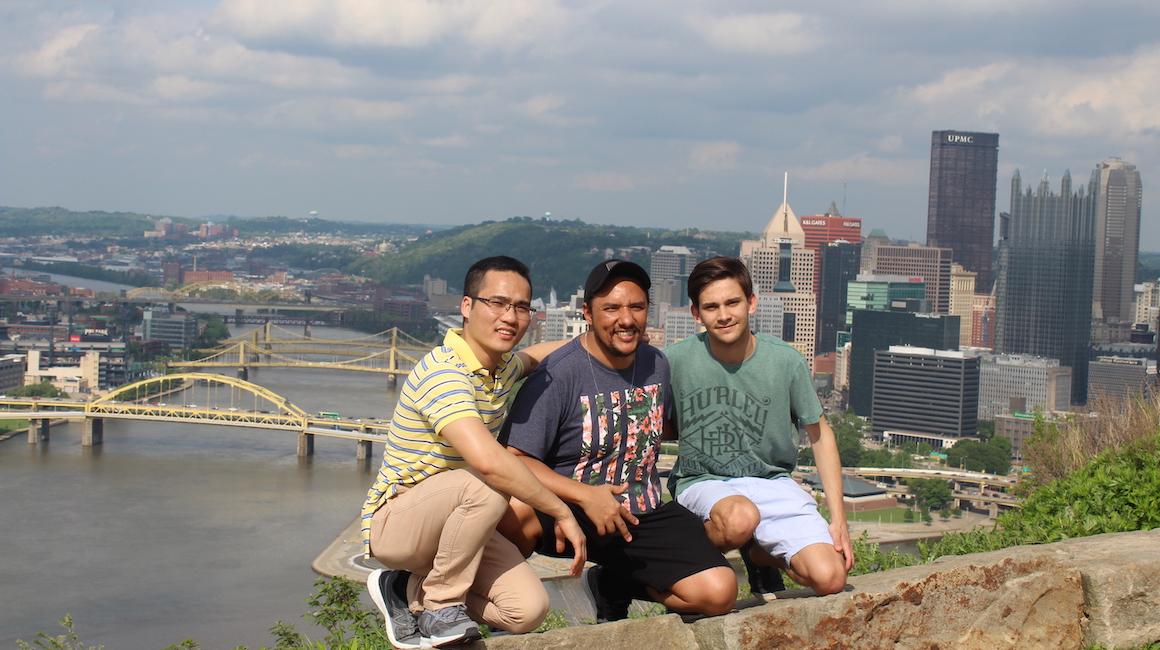students on campus with city in background