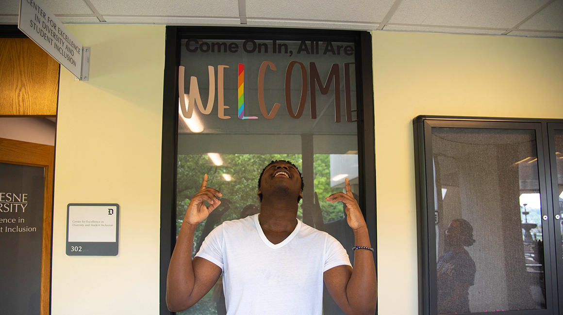 Duquesne student outside of the The Center for Excellence in Diversity and Student Inclusion