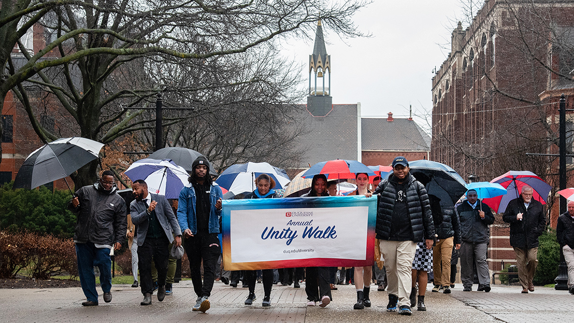 Leaders and participants engaged in the MLK 2023 Unity Walk at Duquesne University