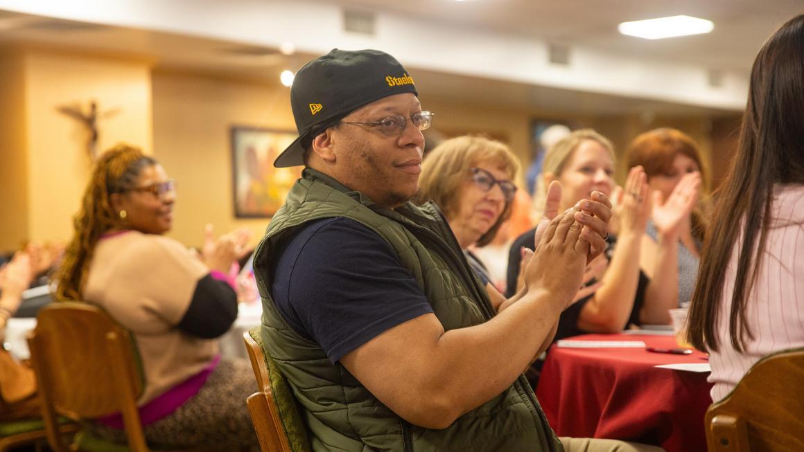 Duquesne DMC staff members Lamont Parker, Beth Jack, Amanda Dabbs and Elizabeth Shestak clapping at the Juneteeth 2025 event