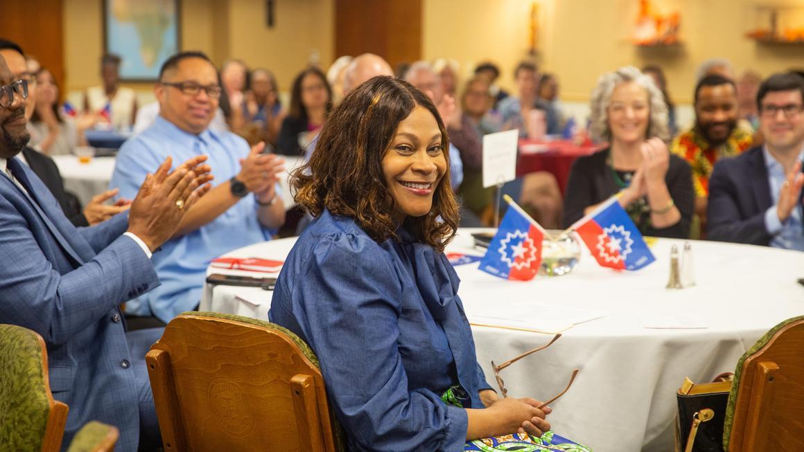 Crystal McCormick Ware smiling at the camera at the Juneteenth 2025 event.