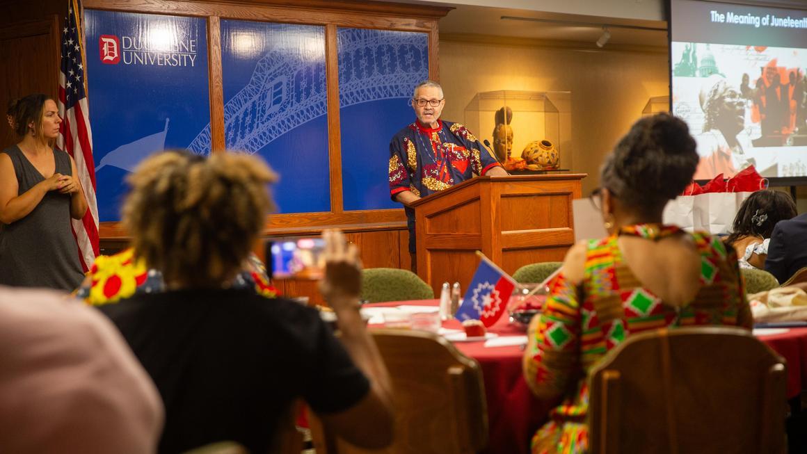 Dr. Anthony B. MItchell, Sr., speaking at the Juneteenth 2025 event.