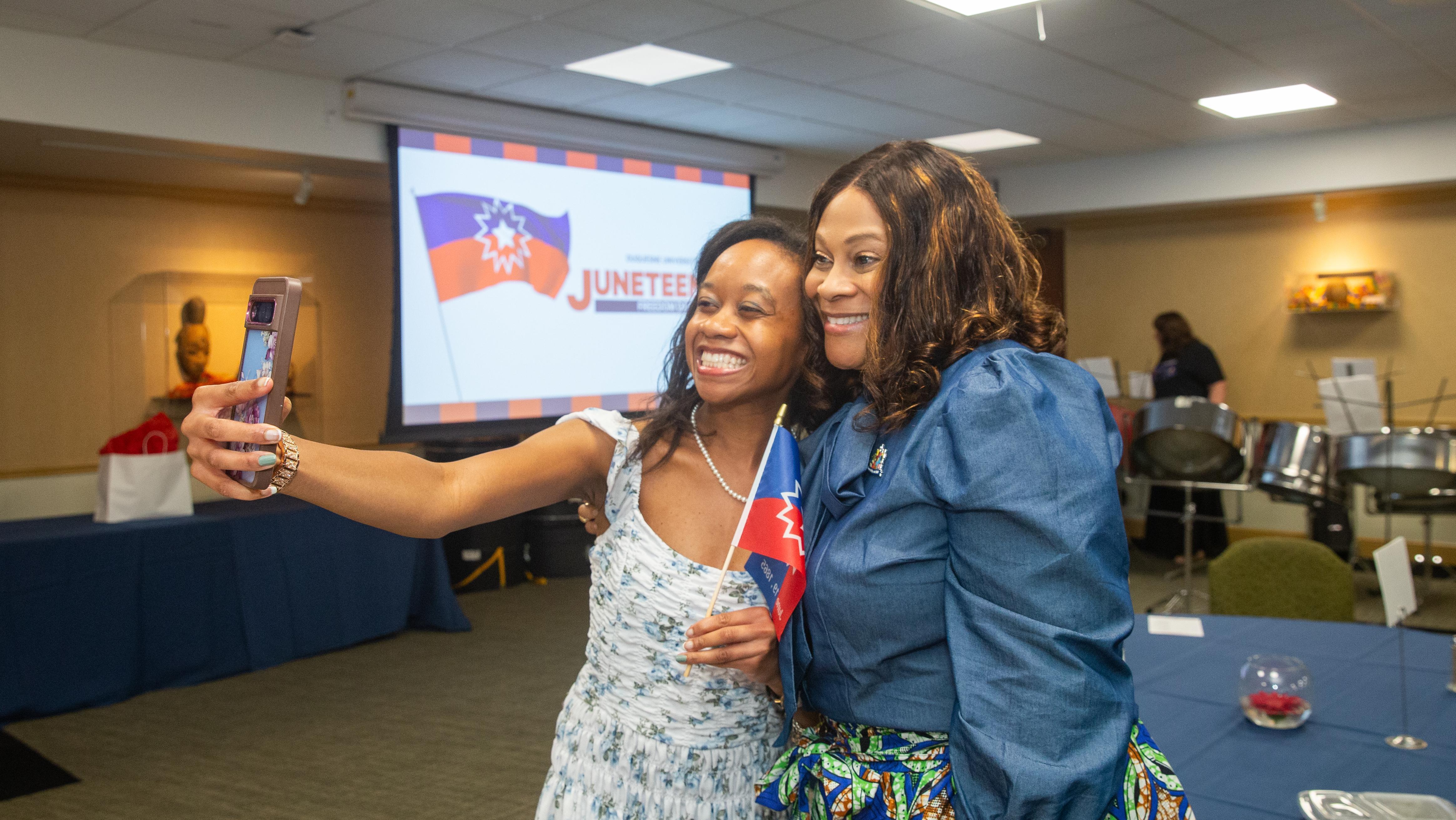 Crystal McCormick Ware and a Duquesne student take a selfie at Juneteenth 2025.