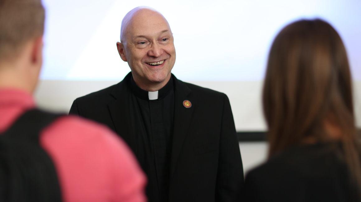 Fr. Sawicki and students chatting