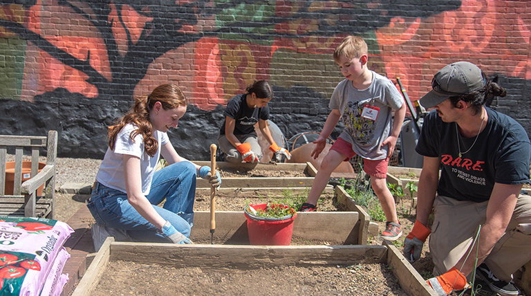 Duquesne University students working in a campus garden.