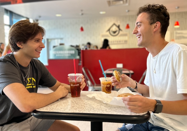 Two students enjoying a meal at Hogan Dining Center.